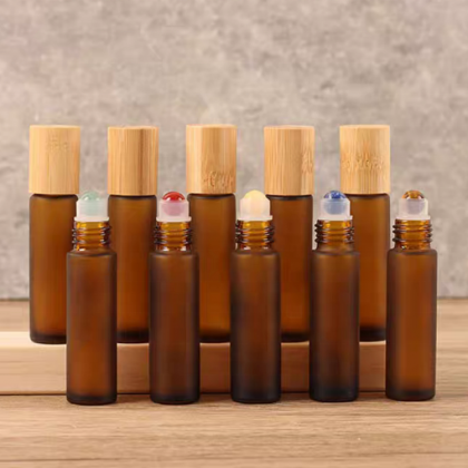 Hot Sale 10ml Glass Roll on Bottle Perfume Essential Oil Glass Bottle Frosted Amber Roller Ball Glass Bottle with Bamboo Cap