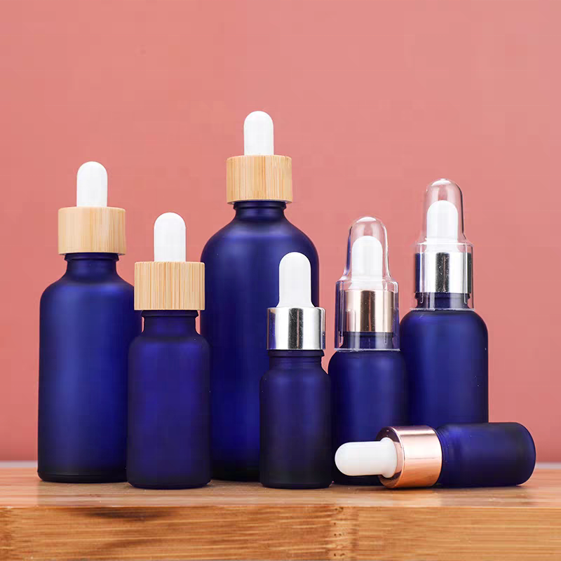 Factory Price 10ml 15ml 20ml 30ml 50ml 100ml Frosted Bamboo Lid Blue Essential Oil Glass Bottle