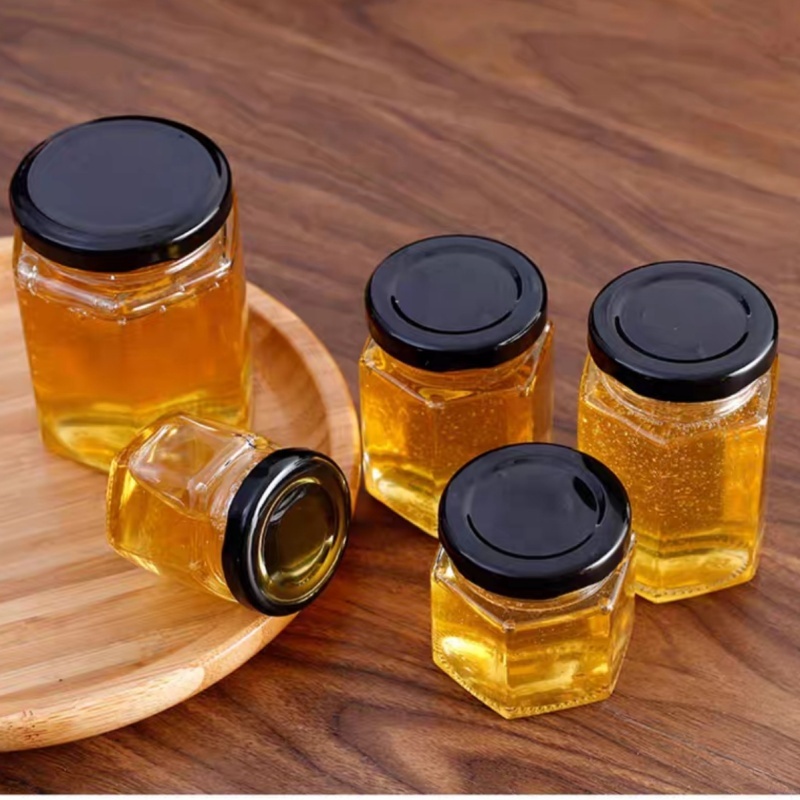 China Manufacturer Cheap 40ml 85ml 100ml 180ml 280ml 380ml 500ml Glass Honey Jar Transparent Hexagon Glass Jars
