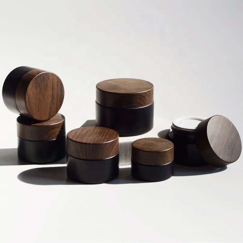 In Stock Wholesale 5/10/15/20/30/50g Matte Black Face Cream Jar Containers 1 2 4 Oz Glass Jars With Plastic Wood Grain Lid