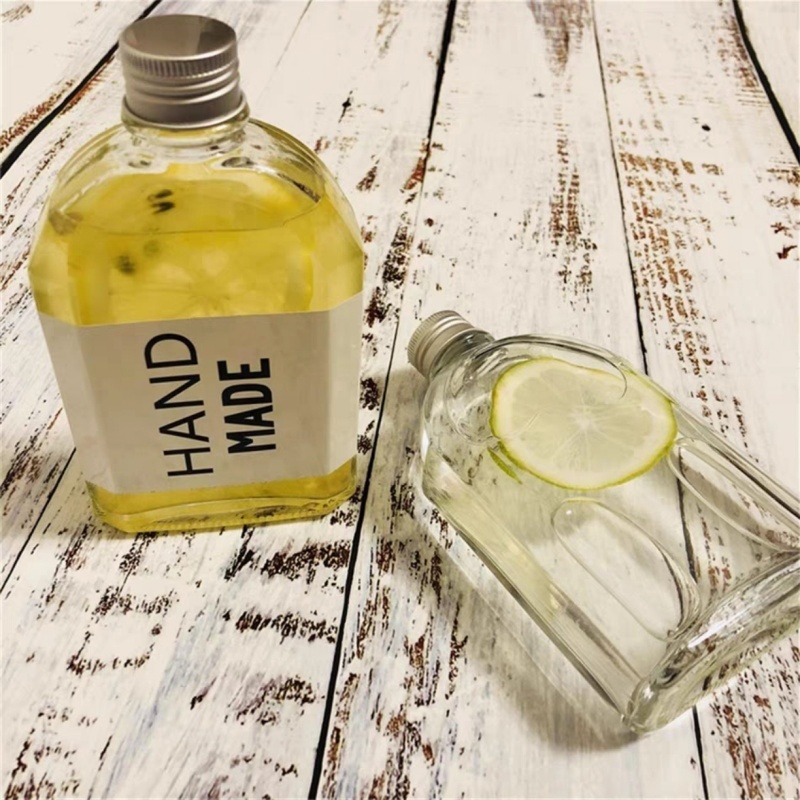 Customized Factory Price Flat Brandy Whisky Gin Tequila Glass Bottle 250ml 500ml Oval Shape Flask Glass Spirits Bottle