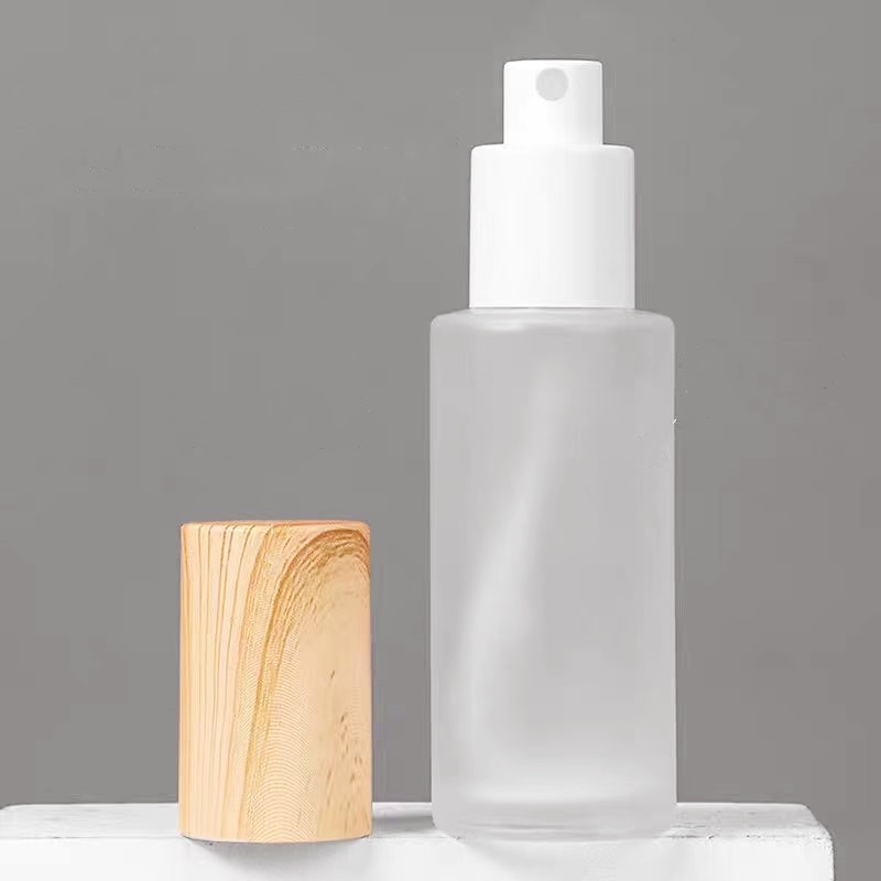 Recyclable Wholesale Empty Frosted Glass Lotion Bottle for Skin Care 30ml 100ml Cosmetic Pump Glass Spray Bottle Manufacturers