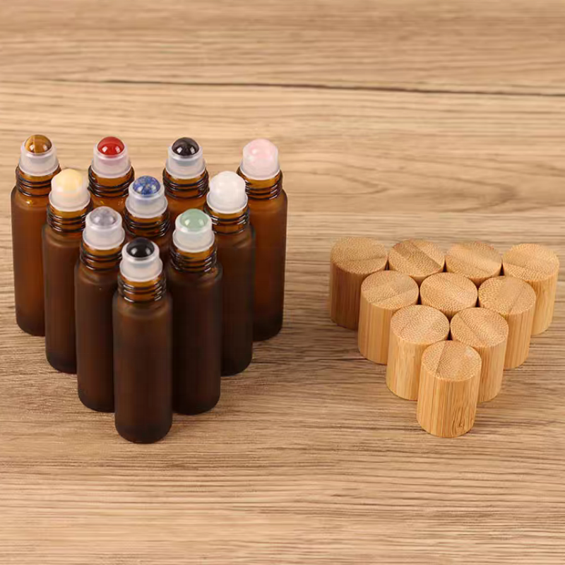 Hot Sale 10ml Glass Roll on Bottle Perfume Essential Oil Glass Bottle Frosted Amber Roller Ball Glass Bottle with Bamboo Cap