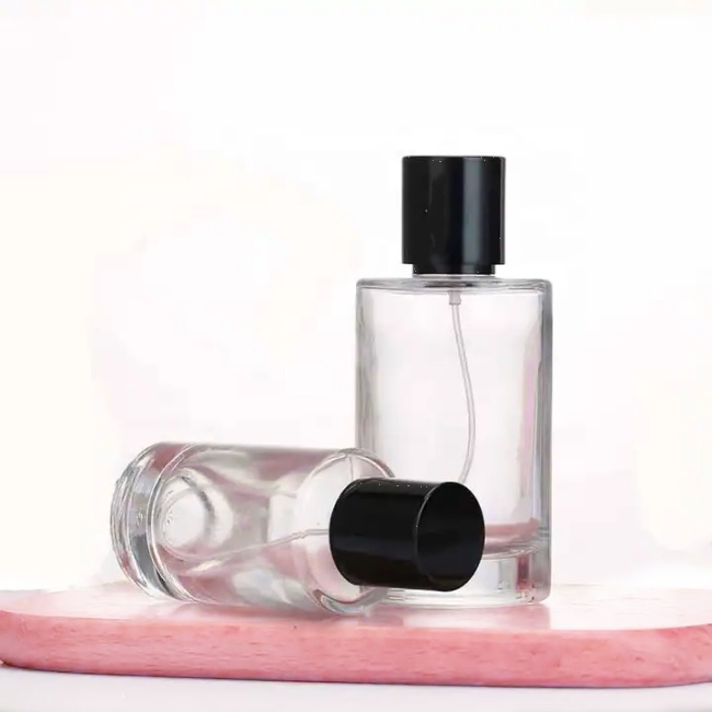 Wholesale Empty Perfume Bottle Luxury 50 Ml 100 Ml Clear High Quality Round Glass Perfume Spray Bottle With Lid