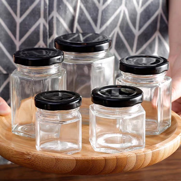 China Manufacturer Cheap 40ml 85ml 100ml 180ml 280ml 380ml 500ml Glass Honey Jar Transparent Hexagon Glass Jars