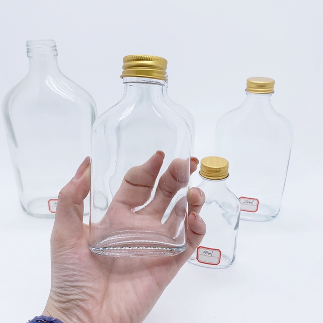 2024 New Launch 50ml 100ml 200ml 250ml 350ml 500ml Custom Empty Glass Liquor Bottle With Screw Cap