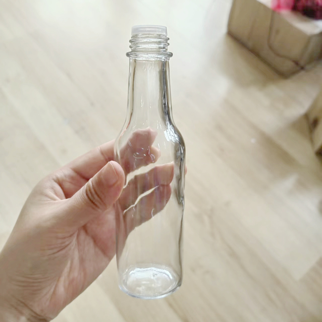Factory Stock 150ml Glass Woozy Bottle BPA-Free 5oz Clear Glass Hot Sauce BBQ Sauce Bottle Shrink Capsules Food Oil Label