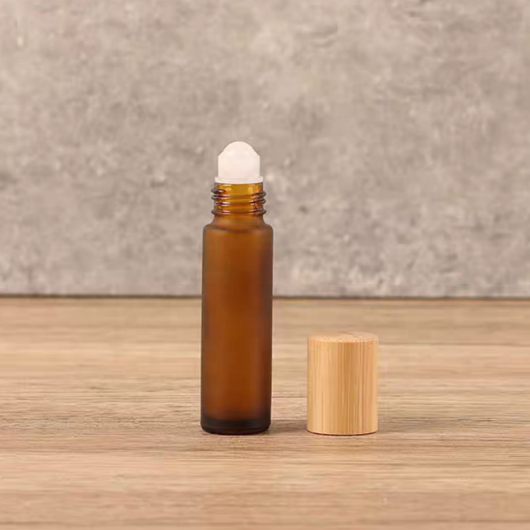 Hot Sale 10ml Glass Roll on Bottle Perfume Essential Oil Glass Bottle Frosted Amber Roller Ball Glass Bottle with Bamboo Cap