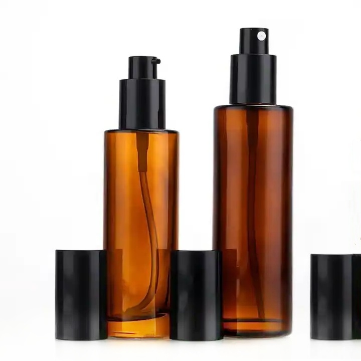 Hot Sale Amber Glass Pump Bottles With Flat Shoulder 30ml 50ml 80ml 100ml Refillable Serum Essential Oil Perfume Lotion Bottle