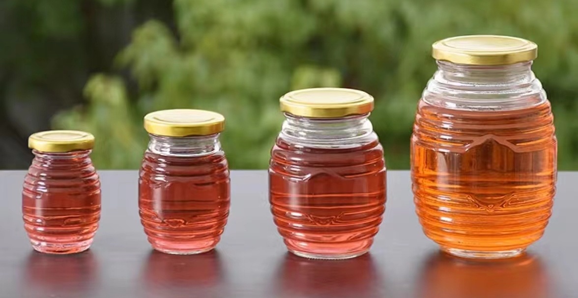 China Factory 100g 250g 500g 1000g Bee Storage Pot Container Thread Shaped Honey Jars Honeycomb Shaped Glass Honey Jars