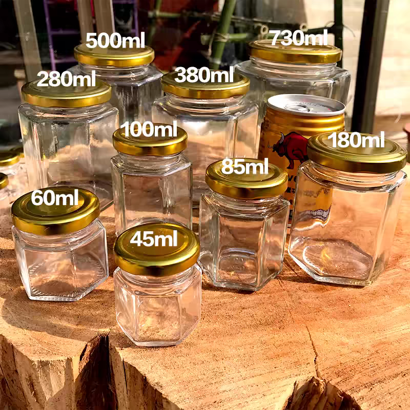 China Manufacturer Cheap 40ml 85ml 100ml 180ml 280ml 380ml 500ml Glass Honey Jar Transparent Hexagon Glass Jars