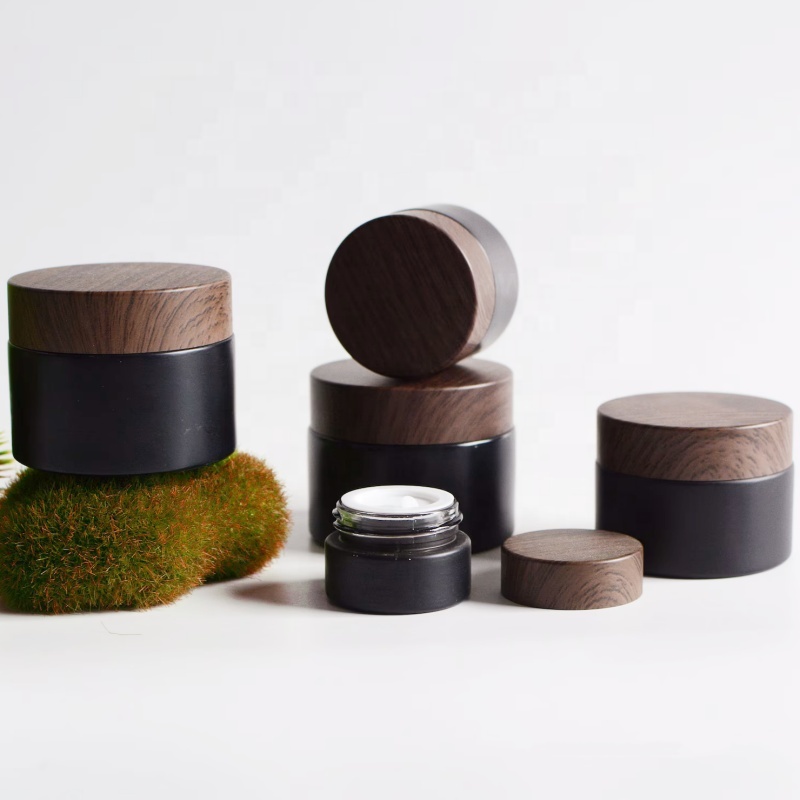 In Stock Wholesale 5/10/15/20/30/50g Matte Black Face Cream Jar Containers 1 2 4 Oz Glass Jars With Plastic Wood Grain Lid
